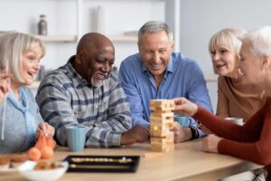 Older adult and family member reviewing home care expenses beside a monthly budget and calculator.