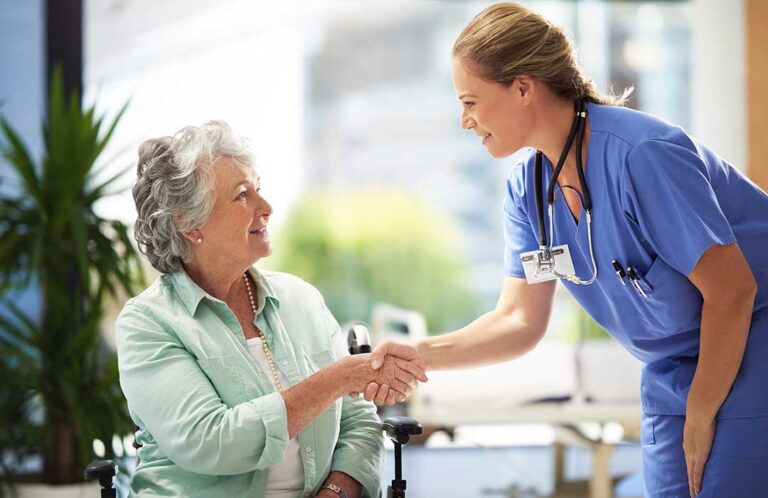 Resident and caregiver reviewing a personalized care plan at a table with medication notes and a calendar.